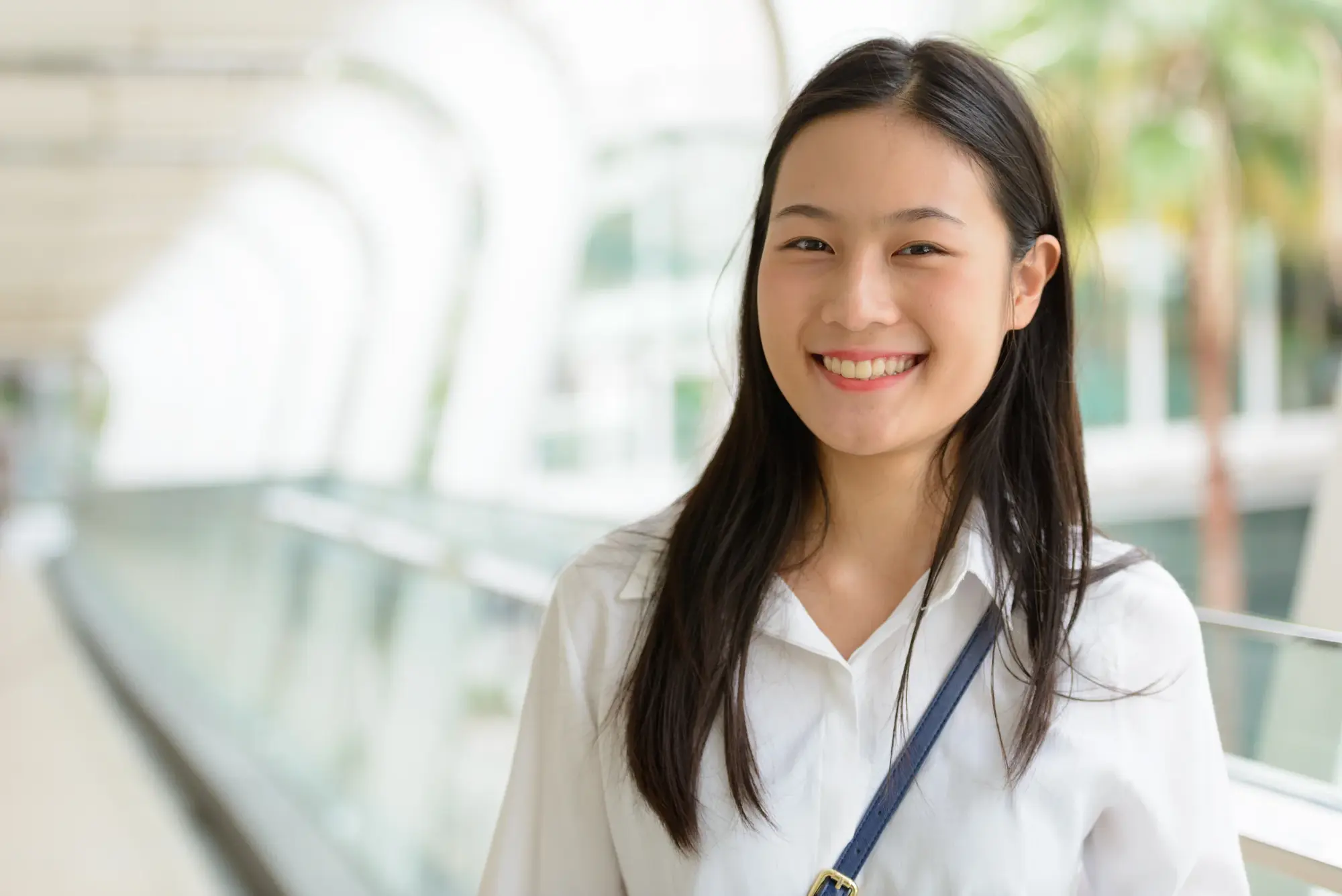 Woman smiling indoors