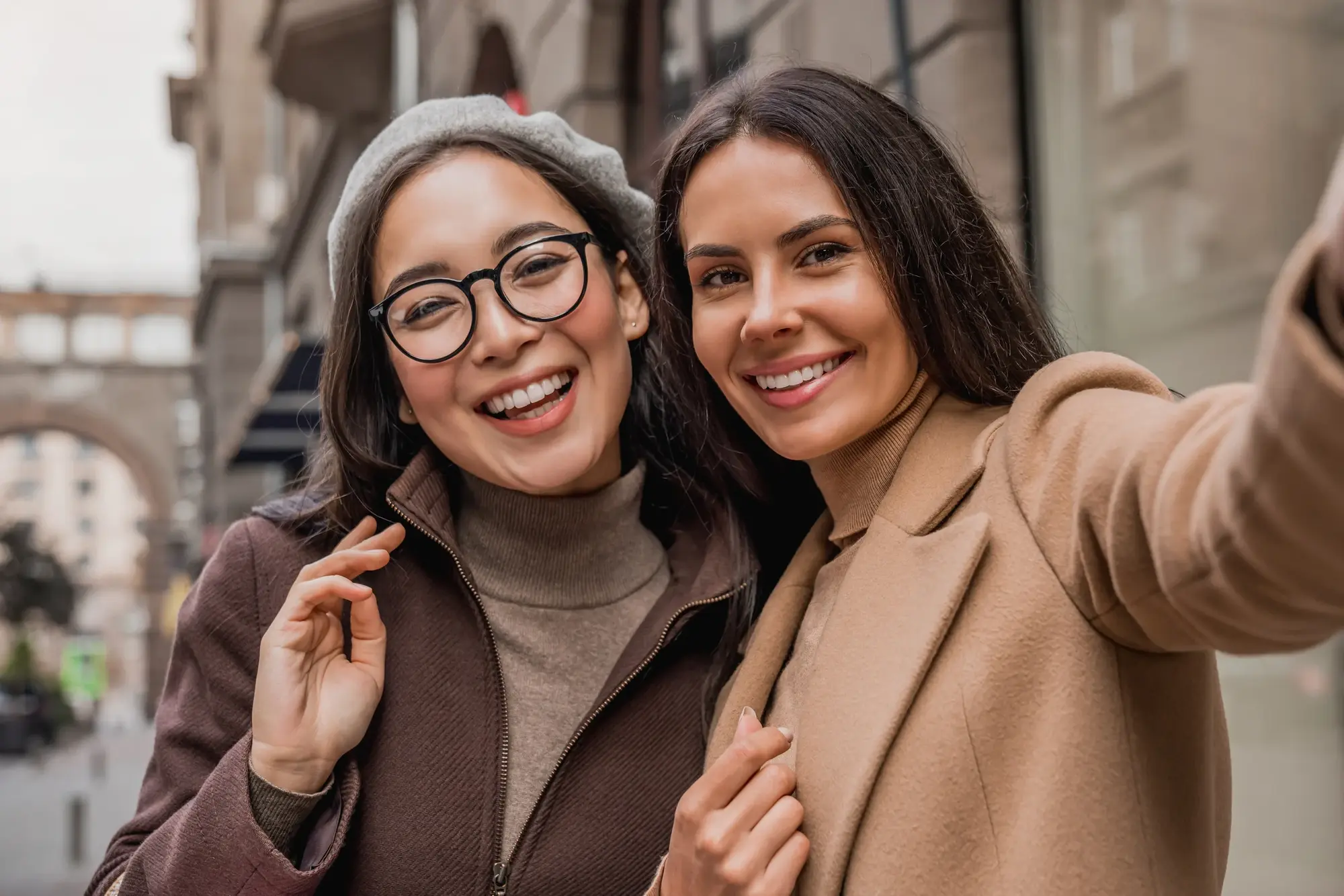 Two friends smiling together